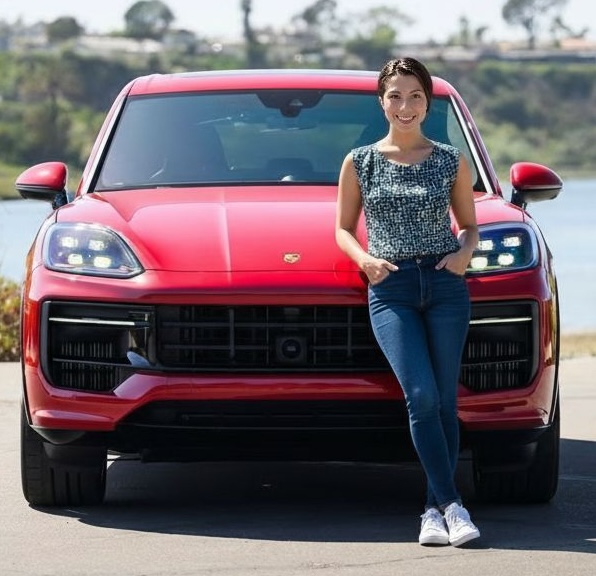 Shopper beside a red Porsche Cayenne Coupe
